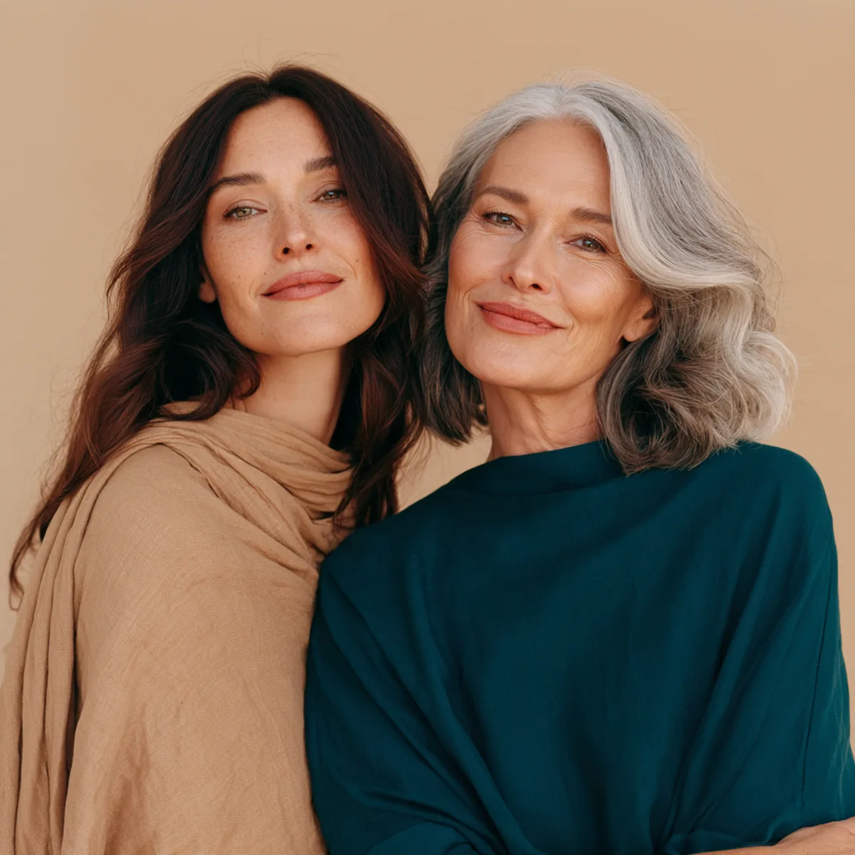 Two women in their forties and fifties looking together at a pack of liquid collagen and smiling